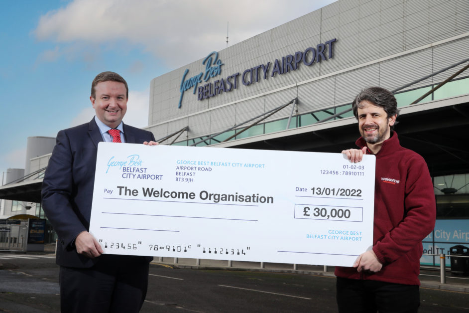 Stephen Patton HR and CR Manager at Belfast City Airport left and Kieran Hughes Marketing and Fundraising Manager at The Welcome Organisation right celebrate flying success of charity partnership